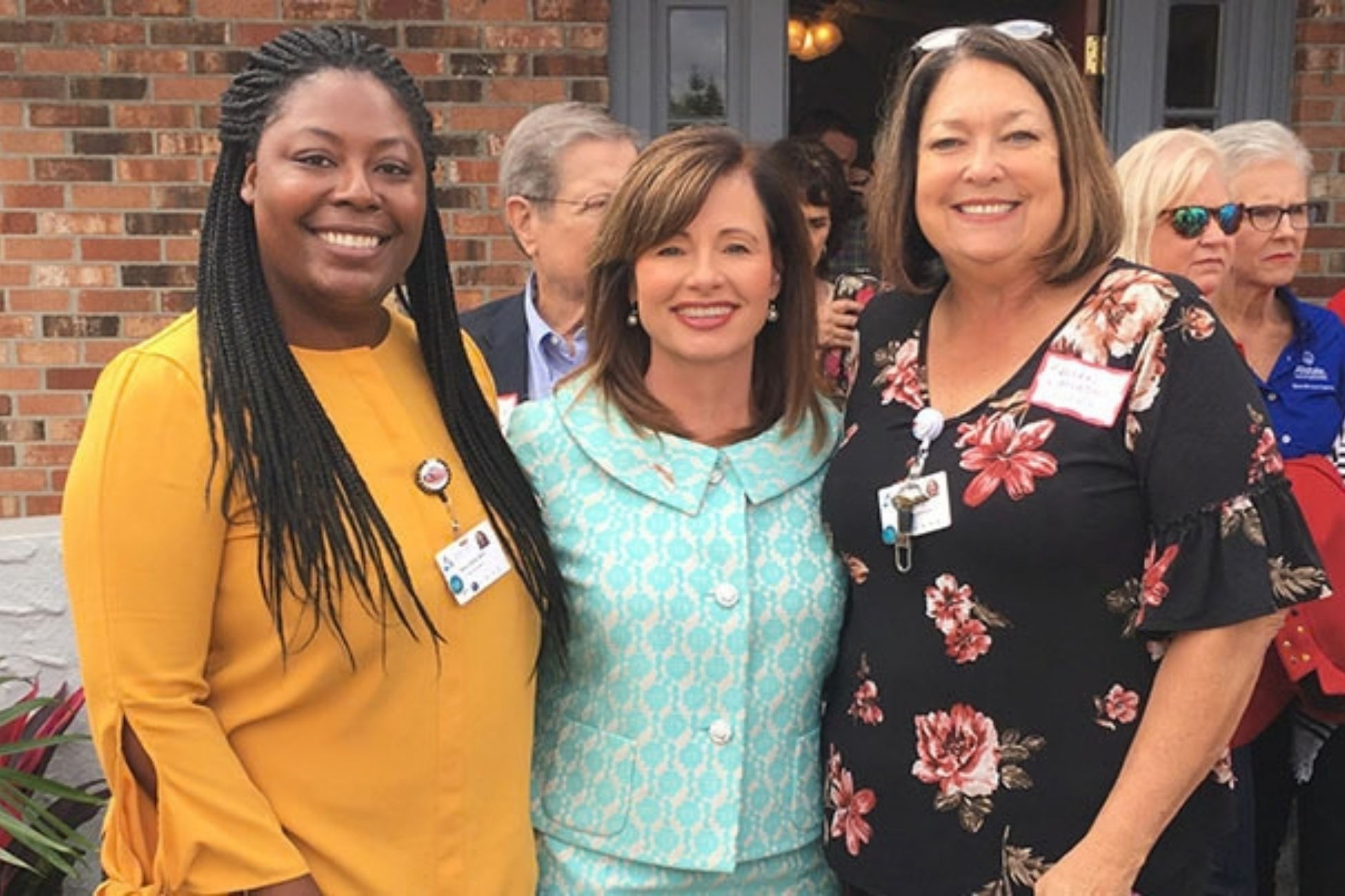 Bartow team members gather together at a community event.